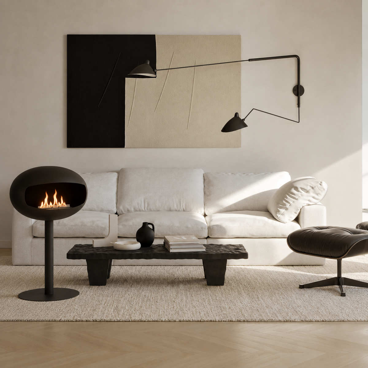 Cheminée éthanol sur pied noire design, salon avec table basse en pierre noire et fauteuil en cuir